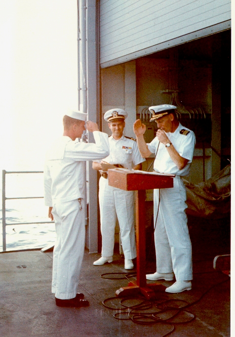 Promotional ceremony on the hanger deck. Hanger for what? Keep going.